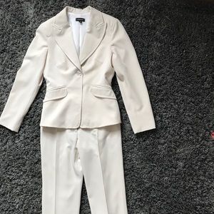 Cream colored Bebe suit size 8 (32’ around hips)
